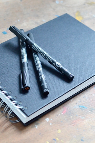 Sketchbook and pens